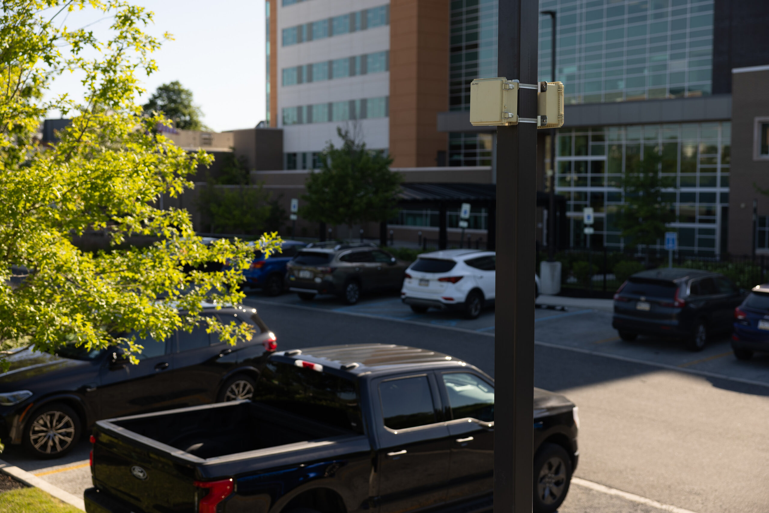 ROAR safety beacon mounted on a pole overlooking a hospital parking lot