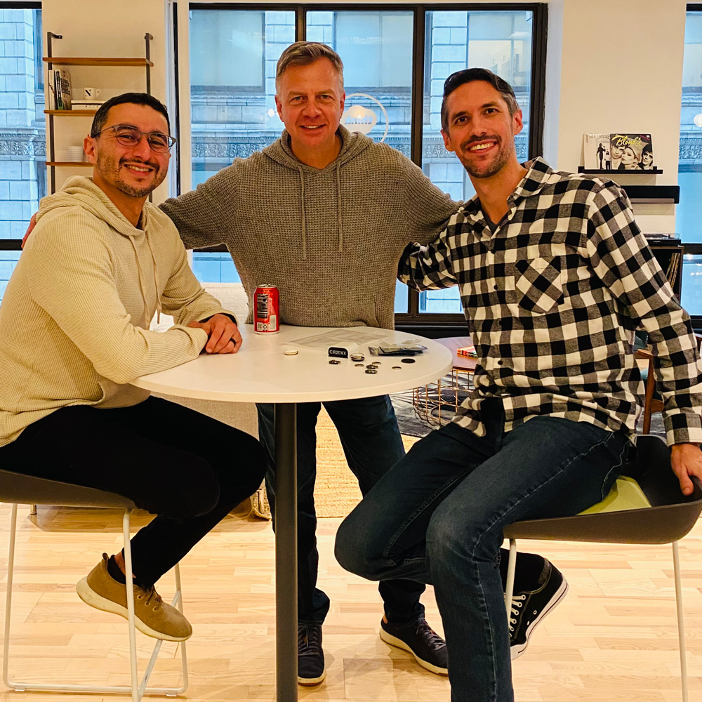 Candid photo of several members of ROAR's executive team in the office